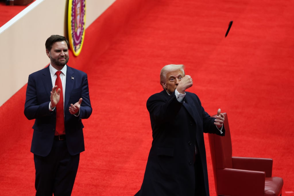 The Inauguration Of Donald J. Trump As The 47th PresidentWASHINGTON, DC - JANUARY 20: U.S. Vice President J.D. Vance watches as U.S. President Donald Trump throws a pen after signing executive orders during an indoor inauguration parade at Capital One Arena on January 20, 2025 in Washington, DC. Donald Trump takes office for his second term as the 47th president of the United States. (Photo by Justin Sullivan/Getty Images)